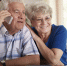 Smiling senior couple making  deal via telephone - Красный уралец